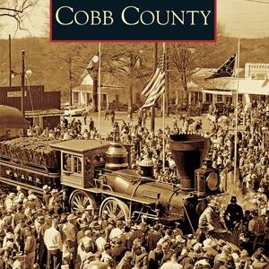 A crowd of people gathered around an old train.