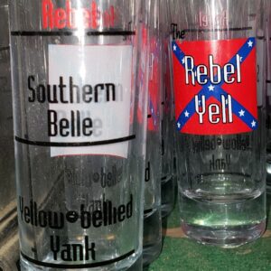 A close up of several glasses with different designs