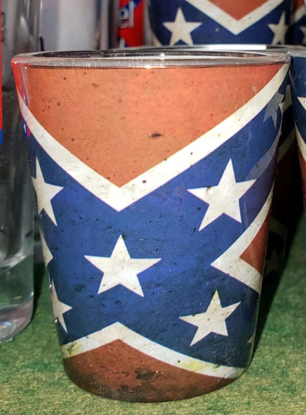 A cup with the confederate flag painted on it.