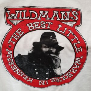 A picture of the wildman 's logo on a t-shirt.