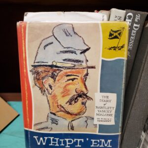 A book with an image of a man in a hat.