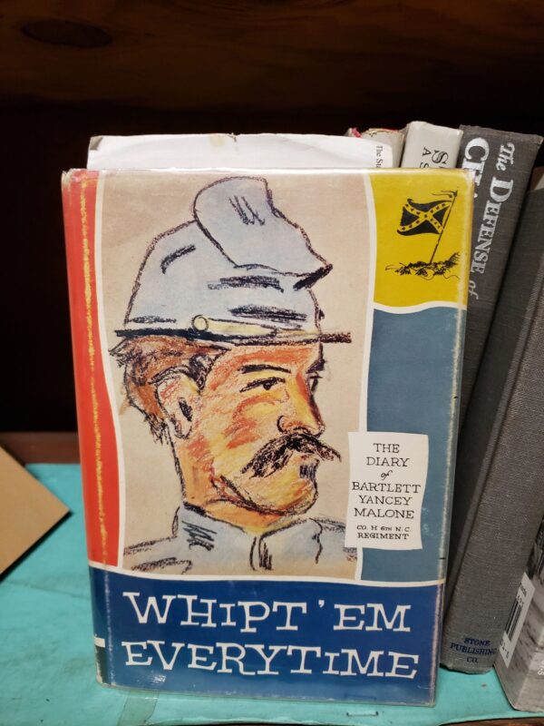 A book with an image of a man in a hat.