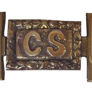 A close up of the letters c and s on a plaque