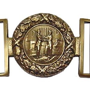 A belt buckle with a picture of a man and woman.