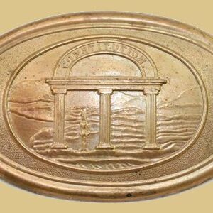 A bronze plaque with an image of the temple.