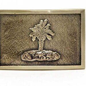 A gold belt buckle with a palm tree on it.