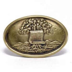 A gold belt buckle with trees and a laptop