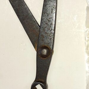 A pair of scissors sitting on top of a table.