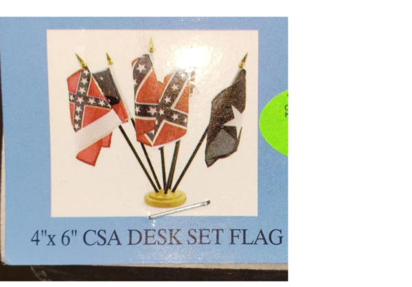 A box of flags with the confederate flag on them.